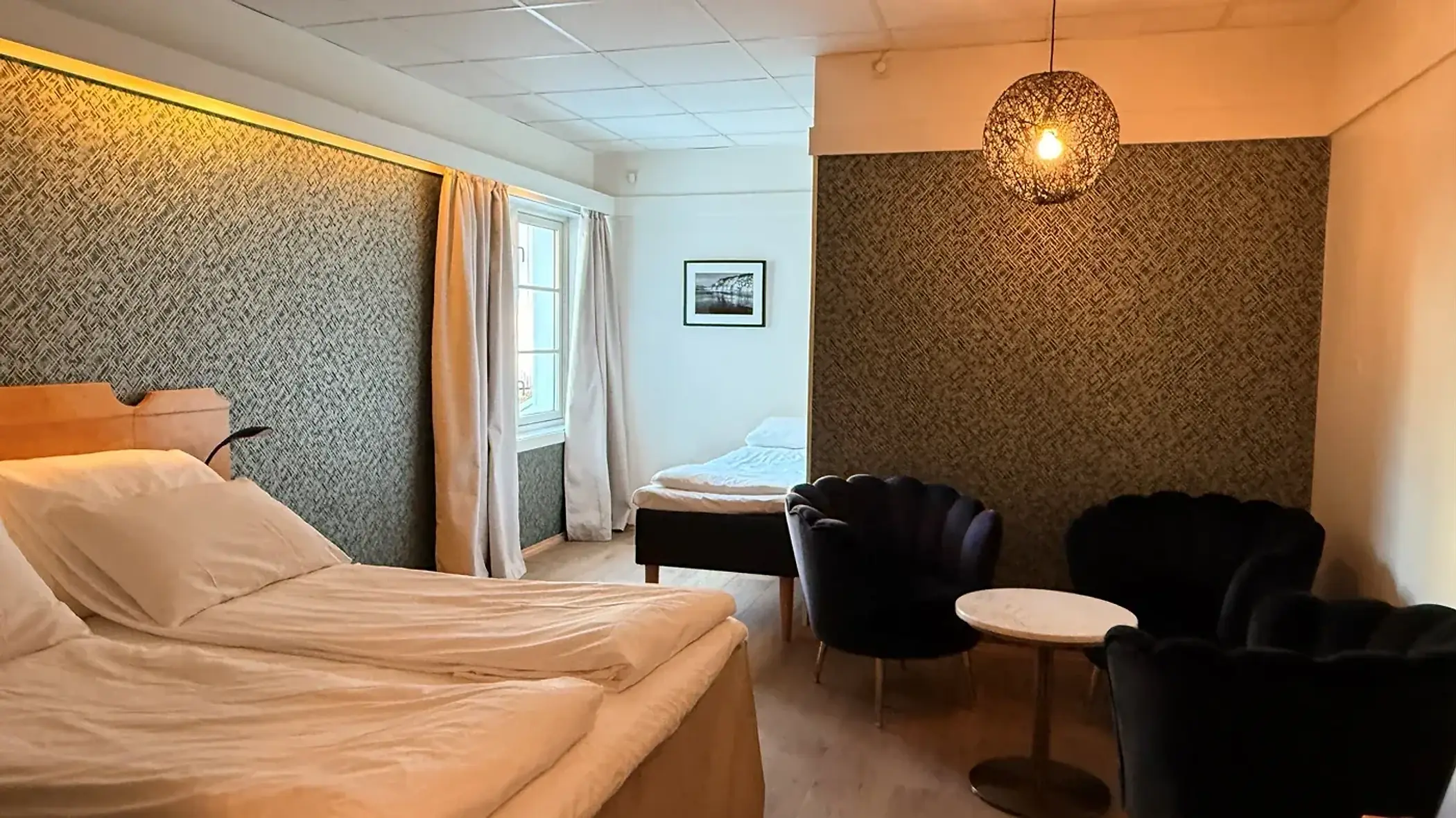 Trippelrom med sittegruppe